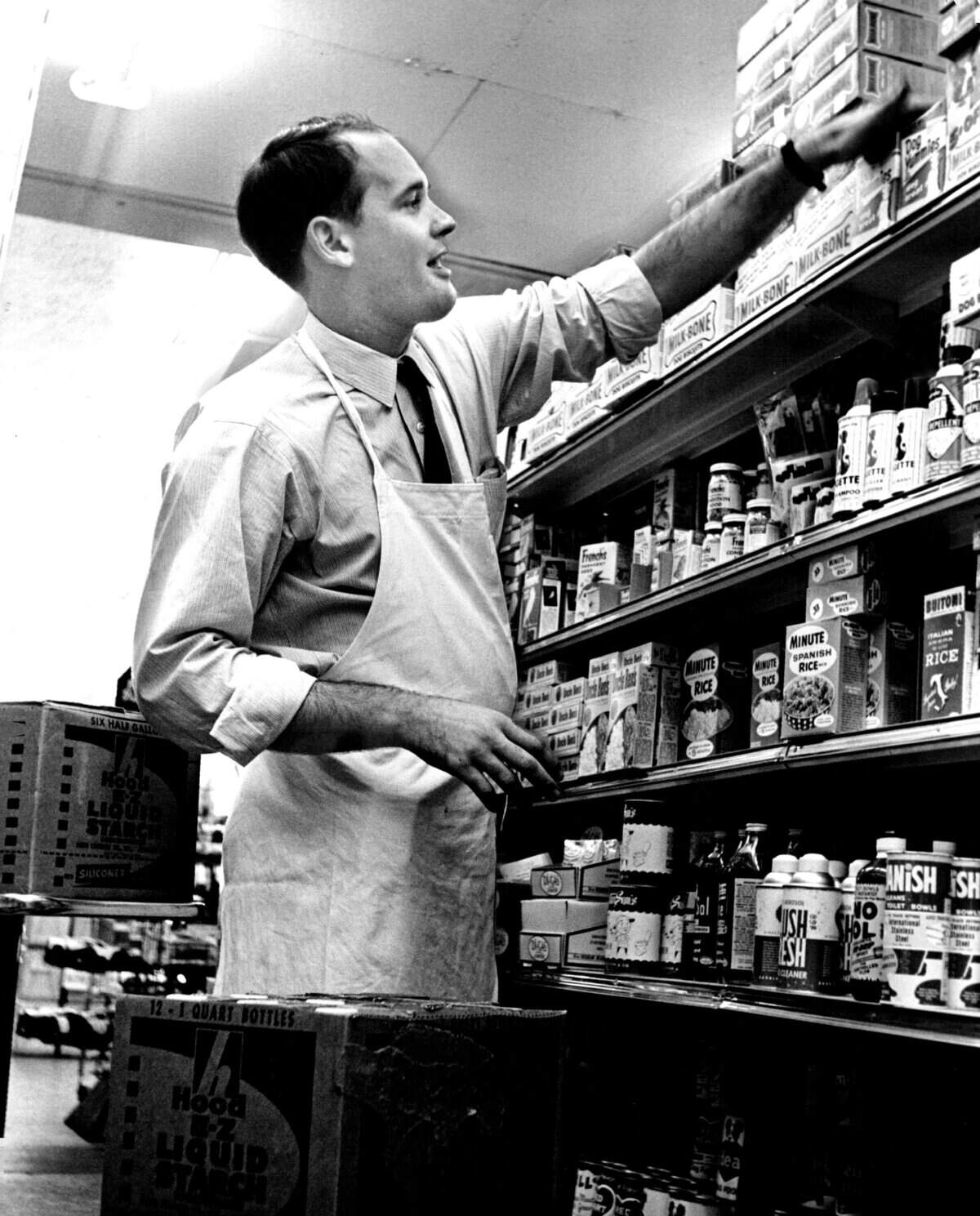 Al Brady stocks the shelves at Epicure on Alton Road in Miami Beach.