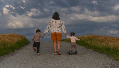 Woman taking care of her children on a rural road in America.