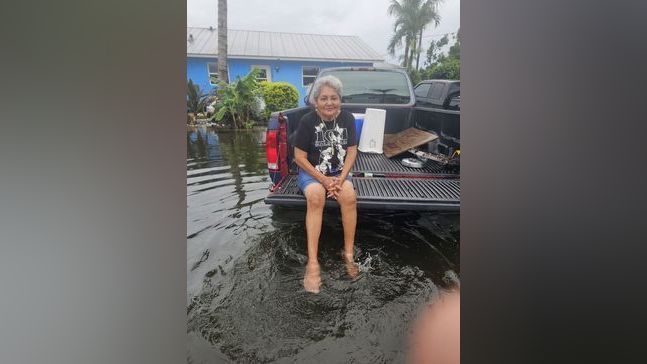 Residents in Indiantown's Booker Park neighborhood are cleaning up flooded homes and cars after several inches of rain turned streets into what neighbors described as a lake Saturday. (Rebecca Ramirez)
