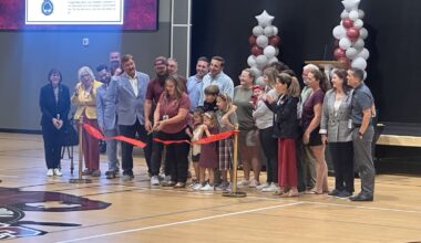 Central Florida Preparatory School head of school Julia Najera cuts the ribbon Friday, Aug. 28, to celebrate the opening of the Robert A. Flanders Athletic and Performing Arts Center. The 24,000-square-foot facility includes a gymnasium, classrooms and space for athletic, academic and performing arts programs.