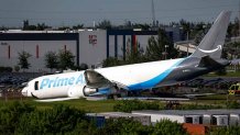 An Amazon cargo plane crashed after overshooting the runway at Miami International Airport (MIA) in Miami, Florida, US, on Sunday, Sept. 6, 2026. The Boeing 767-300, operated by 21 Air as Prime Air Flight 7598, overshot the runway and burst into flames on Sunday, killing at least five people and shutting down the airport's runways. Photographer: Eva Marie Uzcategui/Bloomberg via Getty Images
