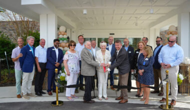 Vicar&rsquo;s Landing staff and guests cutting the ribbon to celebrate the expansion.