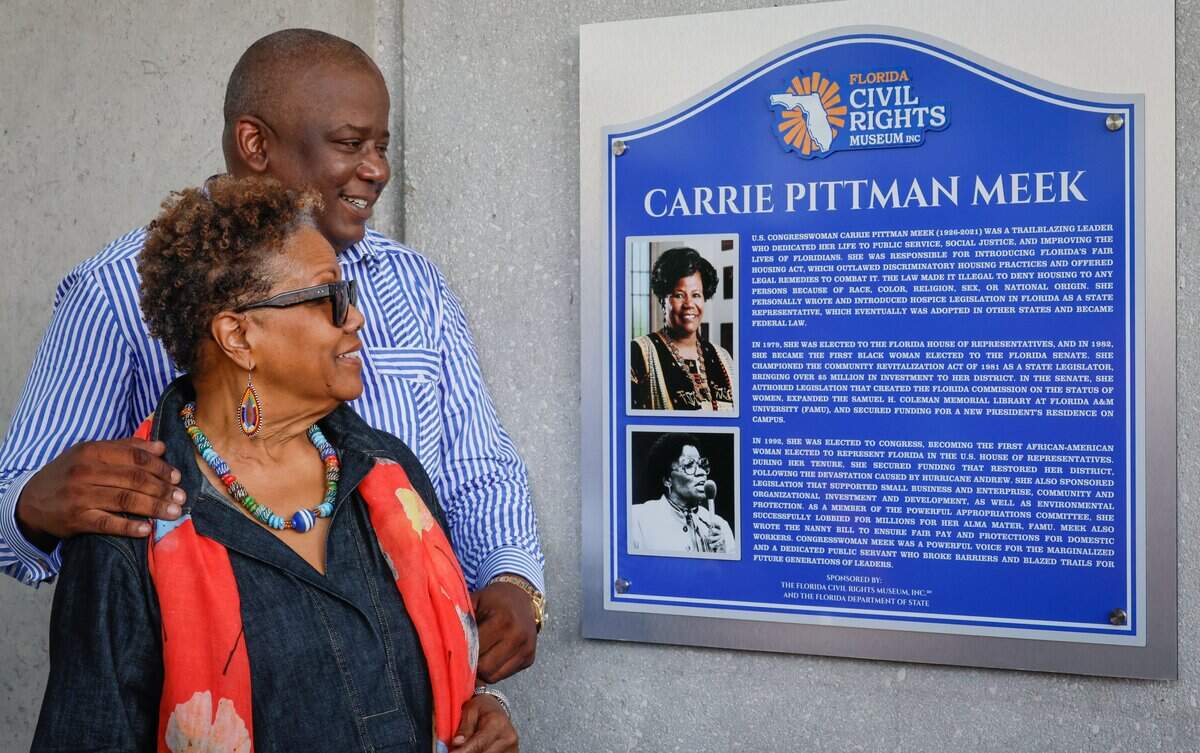Lucia Davis Raiford and her brother, Congressman Kendrick Meek view the new historical marker honoring the life and legacy of their mother, Congresswoman Carrie P. Meek, at the Carrie P. Meek Entrepreneurial Education Center in Miami, Florida, on Saturday, September 5, 2026.