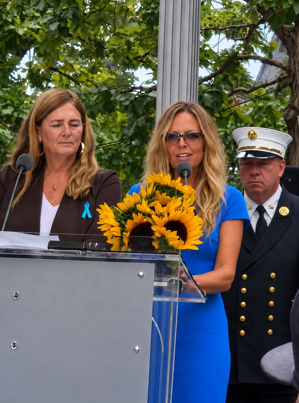 Gabrielle (right) and Aggie (left) reading names together at the 9/11 Memorial Ceremony.