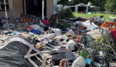 Shopping carts, furniture and piles of debris cover Apopka yard as neighbors ask: When will it be cleaned up?