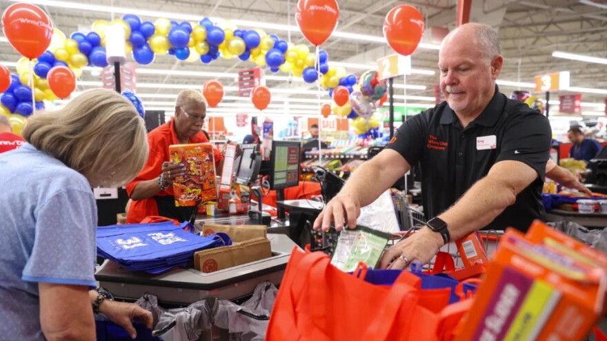 Winn-Dixie regional vice president Greg Stanford, right, and Tom Coughlin Jay Fund CEO Keli Coughlin Joyce package groceries during a surprise shopping spree at a Jacksonville area Winn-Dixie on Tuesday, Sept. 8, 2026. Winn-Dixie and The Jay Fund combined to provide groceries and gift cards for 31 families.