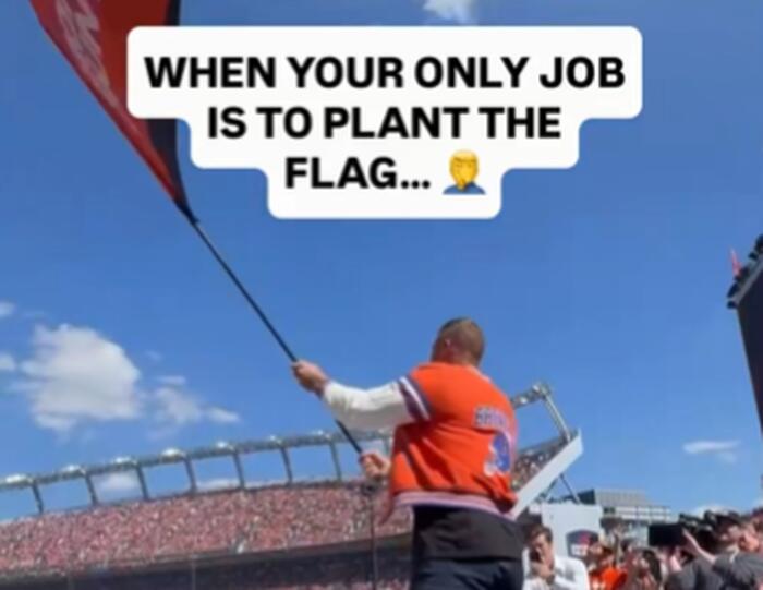 Jacksonville-area native Tim Tebow dresses in Broncos gear, waves flag before Jags game