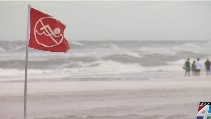 Surfers shrug off nor’easter warnings, hit Jacksonville Beach to catch a wave