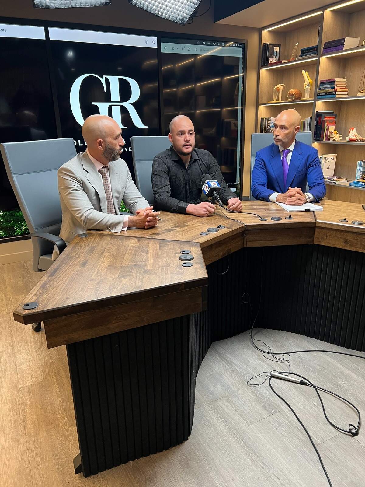 Duviel Aleman, center, describes his father, answers questions on Sept. 25, 2026; lead attorney Judd Rosen, right, and Brett, left.
