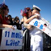 Juan Caceres kisses Heidi Eckstein after disembarking aircraft carrier USS Gerald R. Ford at Naval Station Norfolk on May 16 in Norfolk, Va.