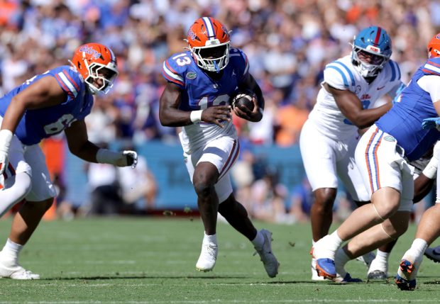 Florida running back Jadan Baugh has thrived in Buster Faulkner's offense while leading the SEC with 600 rushing yards and the nation with 11 touchdowns. (AP Photo/Noah Lantor)