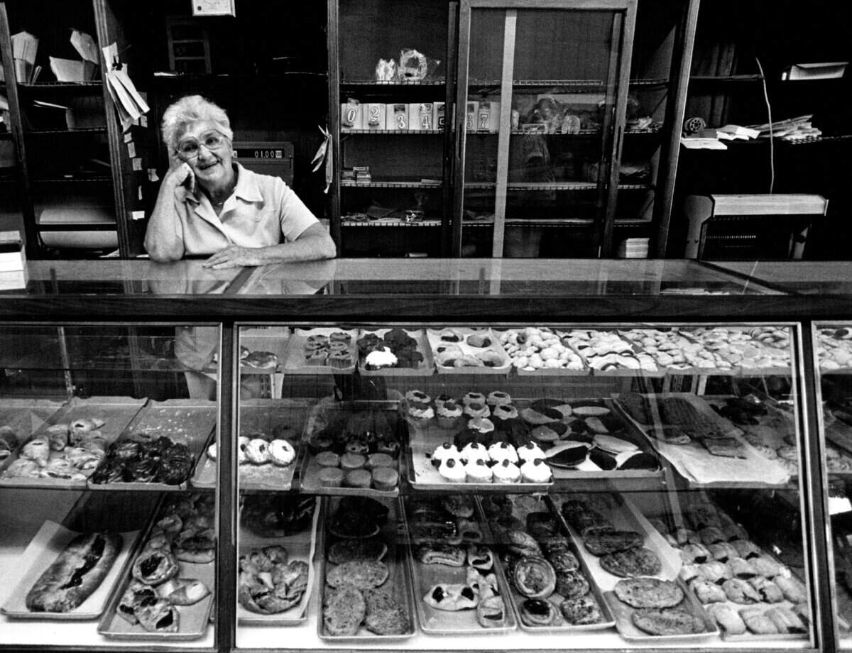 Bakery Saleswoman Louise Peters behind the counter in one of the few places to eat in downtown Miami Shores.