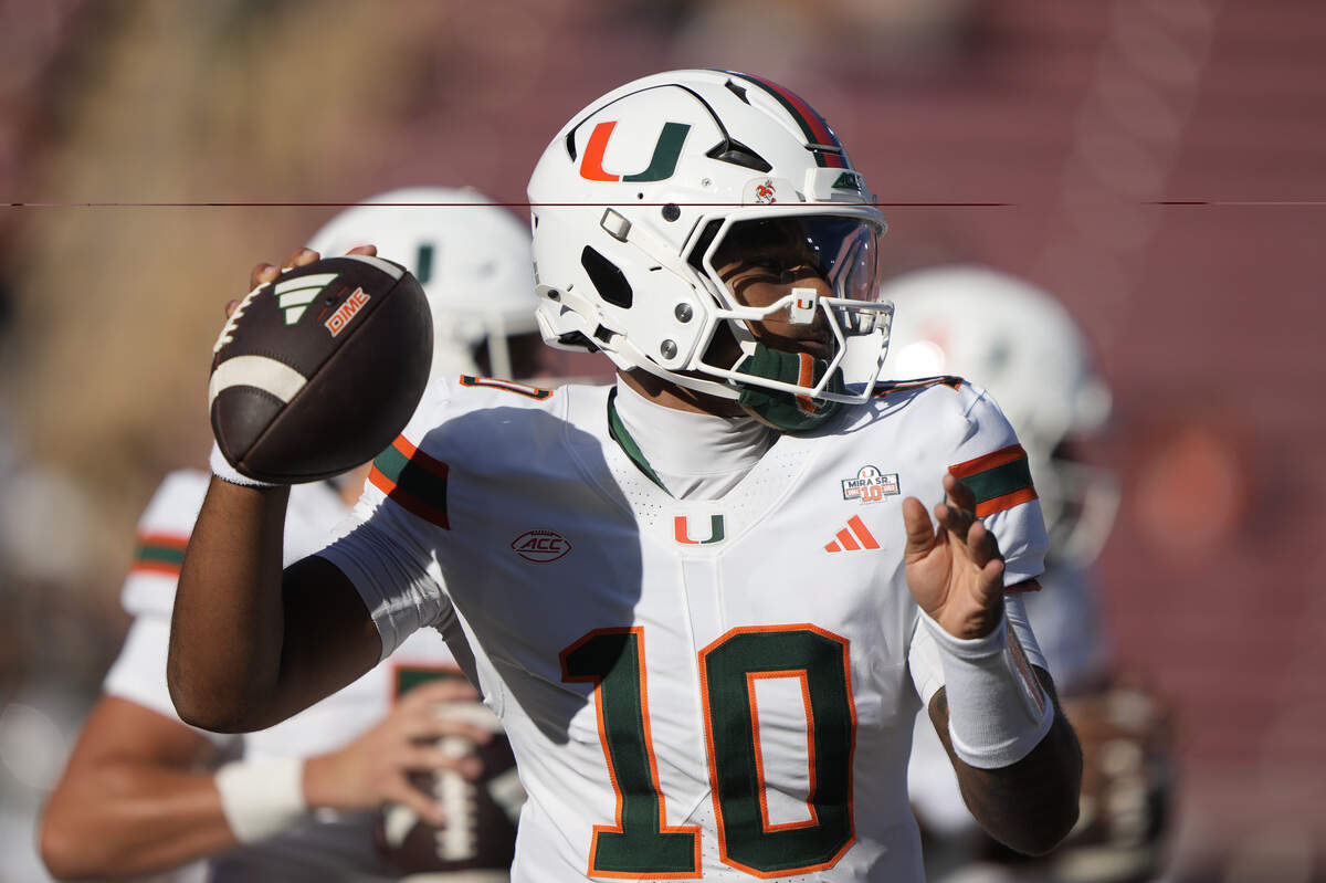 Sep 4, 2026; Stanford, California, USA; Miami Hurricanes quarterback Darian Mensah (10) warms up prior to a game against the Stanford Cardinal at Stanford Stadium. Mandatory Credit: Stan Szeto-Imagn Images