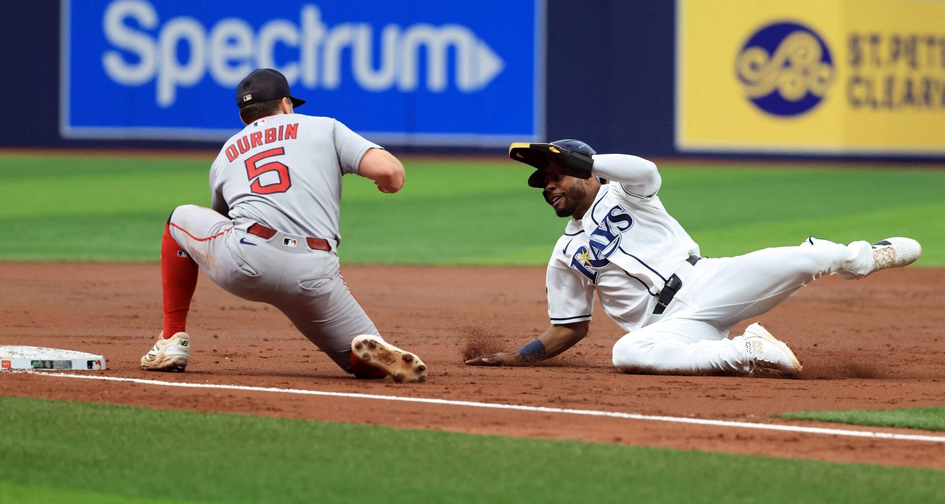 Sep 19, 2026; St. Petersburg, Florida, USA; Boston Red Sox third baseman Caleb Durbin (5) tags out Tampa Bay Rays center fielder Cedric Mullins (31) as he attempted to steal during the third inning at Tropicana Field. Mandatory Credit: Kim Klement Neitzel-Imagn Images