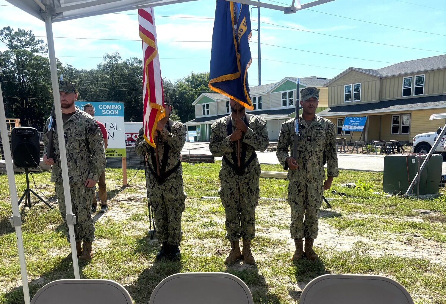 The flag being presented by servicemen from Naval Station Mayport.