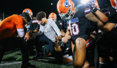 Bishop Gorman head coach Brent Browner prays the Our Father with his team after beating St. Joh ...