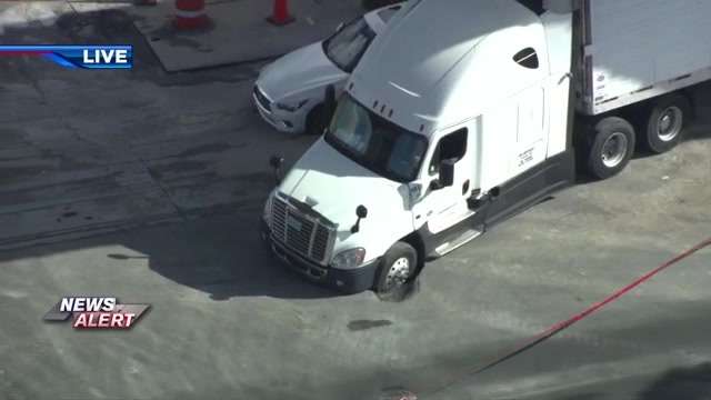 Small sinkhole opens up beneath semi-truck in NW Miami-Dade, shutting down NW 79th St between 27th and 32nd Ave - WSVN 7News | Miami News, Weather, Sports