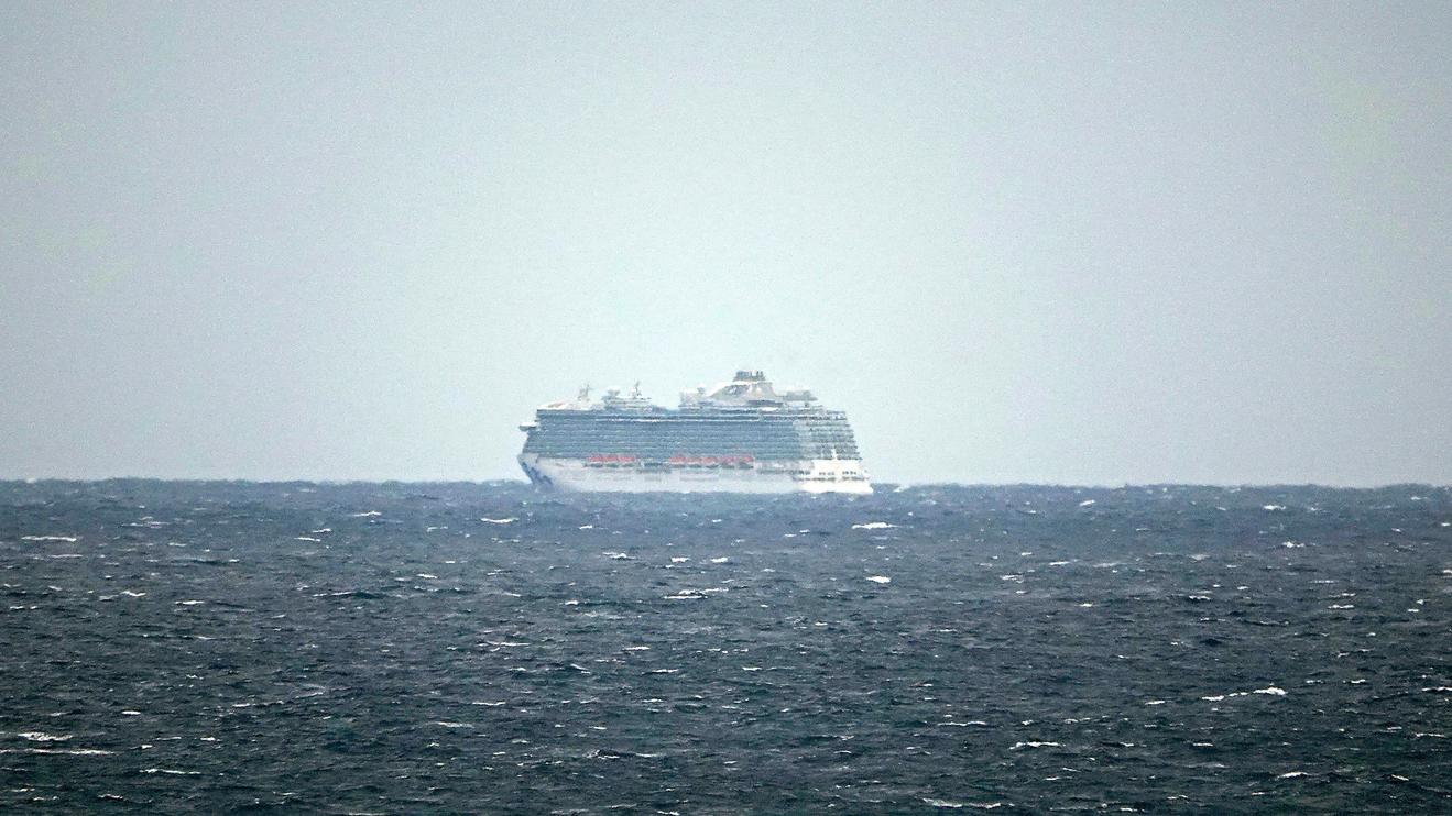 The Regal Princess Cruise ship is seen at sea about 5 miles off the coast of Fort Lauderdale, Fla., Sunday, March 8, 2020. The cruise ship was being held off the coast of Florida Sunday as the ship waits for test results on whether two crew members have contracted the new coronavirus. The crew members in question had transferred from the Grand Princess cruise ship in California where nearly two dozen on board have tested positive for the virus, including multiple crew members. (Joe Cavaretta/South Florida Sun-Sentinel via AP)