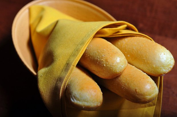 A basket of complimentary breadsticks is served at the Olive Garden in Falls Church, Va. Food critic Tom Sietsema says independent restaurants can learn a thing or two from the big chains like Olive Garden. Illustrates FOOD-CHAINS (category f),(MUST CREDIT: Photo for The Washington Post by Matt McClain)