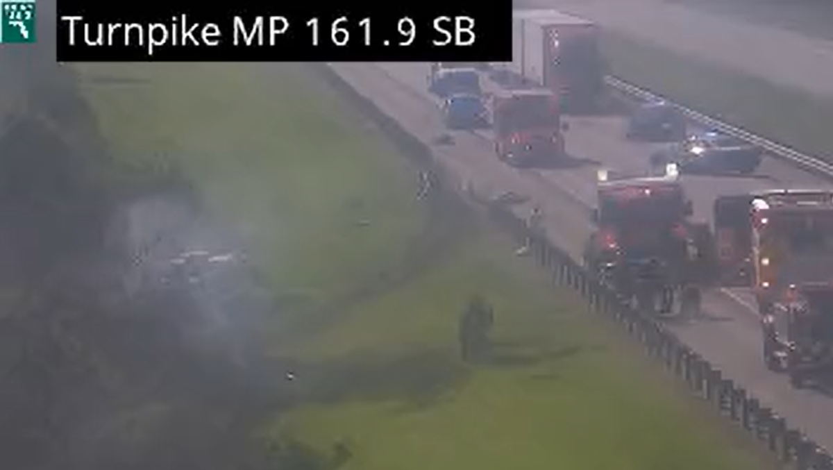 Truck crashes into guardrail and bursts into flames off the turnpike in St. Lucie County