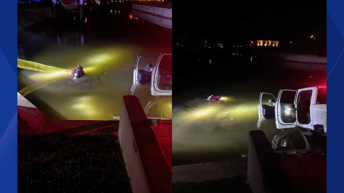 Firefighters respond to partially submerged truck in canal in southwest Cape Coral