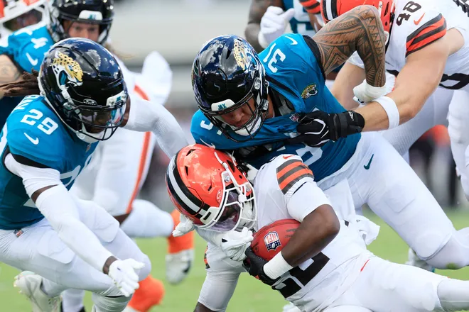 Jacksonville Jaguars linebacker Jahlani Tavai (31) tackles Cleveland Browns running back Dylan Sampson (22) during the first quarter of an NFL football matchup at EverBank Stadium on Sunday, Sept. 13, 2026, in Jacksonville, Fla. [Corey Perrine/Florida Times-Union]