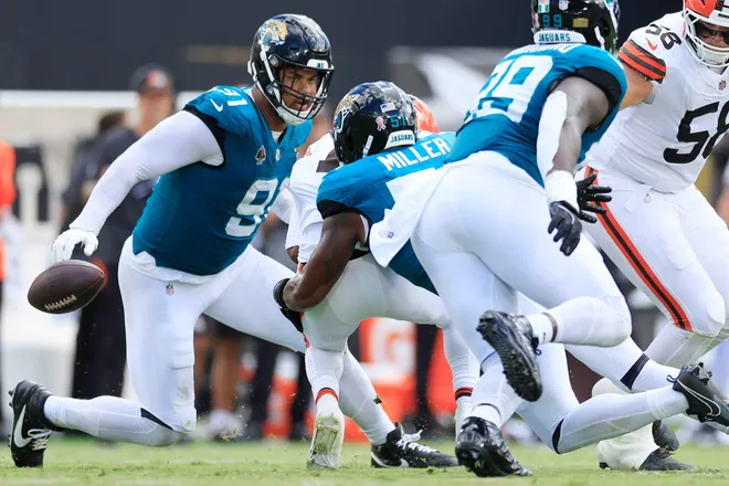 Jacksonville Jaguars linebacker Ventrell Miller (51) forces a fumble turnover on Cleveland Browns wide receiver KC Concepcion Jr. (1) during the second quarter of an NFL football matchup at EverBank Stadium on Sunday, Sept. 13, 2026, in Jacksonville, Fla. [Corey Perrine/Florida Times-Union]