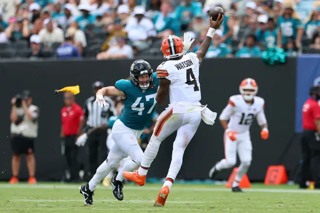 Sep 13, 2026; Jacksonville, Florida, USA; Cleveland Browns quarterback Deshaun Watson (4) attempts a pass under pressure from Jacksonville Jaguars linebacker Dennis Gardeck (47) in the second quarter at EverBank Stadium. Mandatory Credit: Nathan Ray Seebeck-Imagn Images