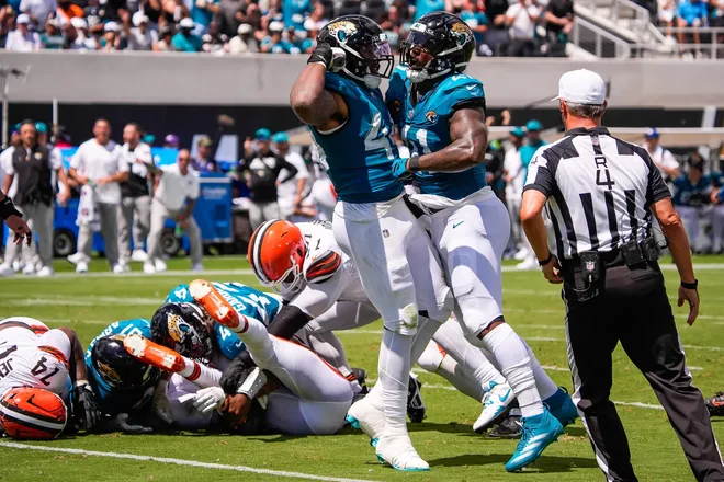 Jacksonville Jaguars defensive end Travon Walker (44) and Jacksonville Jaguars defensive end Josh Hines-Allen (41) celebrate a sack and fumble of Cleveland Browns quarterback Deshaun Watson (4) in the first quarter during an NFL football game at EverBank Stadium, Sunday, September 13, 2026, in Jacksonville, Fla. Jaguars lead 24-0 at the half.  [Doug Engle/Florida Times-Union]