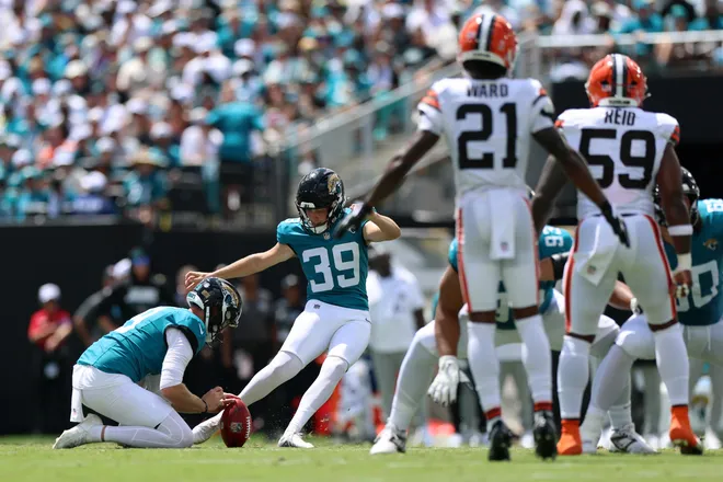 Sep 13, 2026; Jacksonville, Florida, USA; Jacksonville Jaguars kicker Cam Little (39) kicks a field goal on a hold from punter Logan Cooke (9) as Cleveland Browns cornerback Denzel Ward (21) and linebacker Winston Reid (59) look on in the second quarter at EverBank Stadium. Mandatory Credit: Nathan Ray Seebeck-Imagn Images