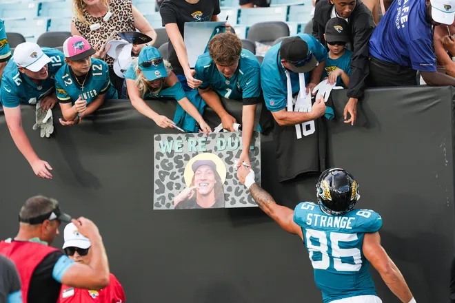 Jacksonville Jaguars tight end Brenton Strange (85) hands off a game glove to a fan after an NFL football game at EverBank Stadium, Sunday, September 13, 2026, in Jacksonville, Fla. The Jaguars defeated the Browns 34-10. [Doug Engle/Florida Times-Union]