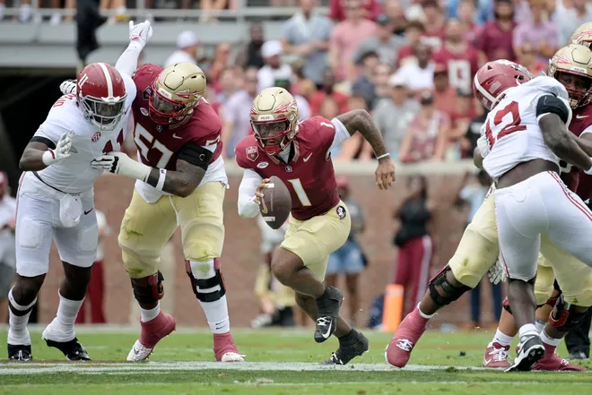 Aug 30, 2025; Tallahassee, Florida, USA; Florida State Seminoles quarterback Tommy Castellanos (1) runs with the ball against the Alabama Crimson Tide during the second half at Doak S. Campbell Stadium. Mandatory Credit: Melina Myers-Imagn Images