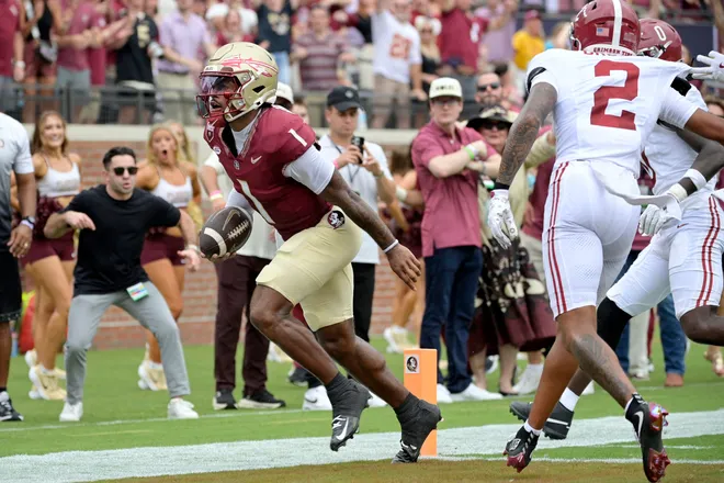 Aug 30, 2025; Tallahassee, Florida, USA; Florida State Seminoles quarterback Tommy Castellanos (1) runs for a touchdown against the Alabama Crimson Tide during the first half at Doak S. Campbell Stadium. Mandatory Credit: Melina Myers-Imagn Images