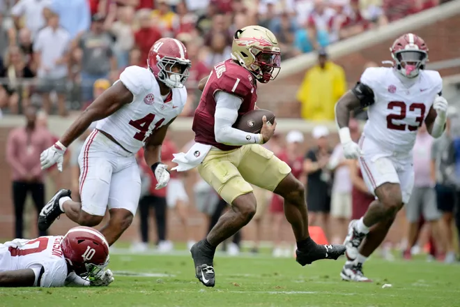 Aug 30, 2025; Tallahassee, Florida, USA; Florida State Seminoles quarterback Tommy Castellanos (1) runs with the ball against the Alabama Crimson Tide during the second half at Doak S. Campbell Stadium. Mandatory Credit: Melina Myers-Imagn Images