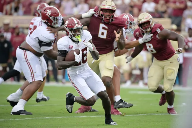 Aug 30, 2025; Tallahassee, Florida, USA; Alabama Crimson Tide running back Kevin Riley (28) runs with the ball against the Florida State Seminoles during the first half at Doak S. Campbell Stadium. Mandatory Credit: Melina Myers-Imagn Images