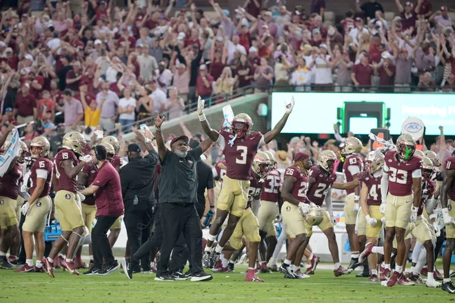 Aug 30, 2025; Tallahassee, Florida, USA; Florida State Seminoles running back Kam Davis (3) and associate head coach Odell Haggins react after a play Alabama Crimson Tide during the second half at Doak S. Campbell Stadium. Mandatory Credit: Melina Myers-Imagn Images