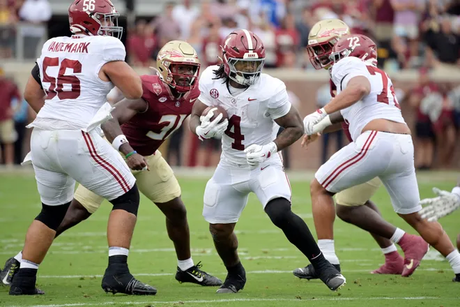 Aug 30, 2025; Tallahassee, Florida, USA; Alabama Crimson Tide running back Daniel Hill (4) runs with the ball against the Florida State Seminoles during the first half at Doak S. Campbell Stadium. Mandatory Credit: Melina Myers-Imagn Images