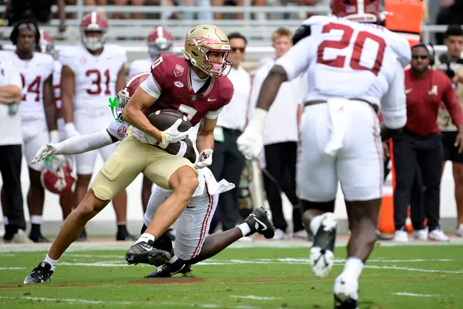 Aug 30, 2025; Tallahassee, Florida, USA; Florida State Seminoles wide receiver Duce Robinson (0) makes a catch against the Alabama Crimson Tide during the first half at Doak S. Campbell Stadium. Mandatory Credit: Melina Myers-Imagn Images