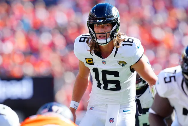 Sep 20, 2026; Denver, Colorado, USA;  Jacksonville Jaguars quarterback Trevor Lawrence (16) calls out signals against the Denver Broncos during the second half at Empower Field at Mile High.  Mandatory Credit: Ron Chenoy-Imagn Images