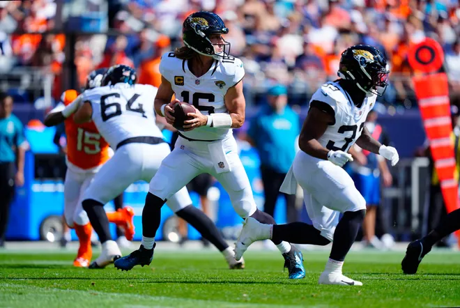 Sep 20, 2026; Denver, Colorado, USA;  Jacksonville Jaguars quarterback Trevor Lawrence (16) stands in the pocket against the Denver Broncos during the first quarter at Empower Field at Mile High.  Mandatory Credit: Ron Chenoy-Imagn Images