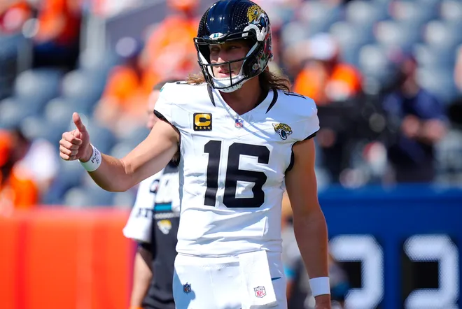 Sep 20, 2026; Denver, Colorado, USA;  Jacksonville Jaguars quarterback Trevor Lawrence (16) warms up prior to a game against the Denver Broncos at Empower Field at Mile High.  Mandatory Credit: Ron Chenoy-Imagn Images