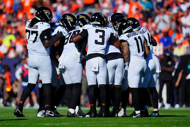 Sep 20, 2026; Denver, Colorado, USA;  The Jacksonville Jaguars huddle up against the Denver Broncos during the second half at Empower Field at Mile High.  Mandatory Credit: Ron Chenoy-Imagn Images