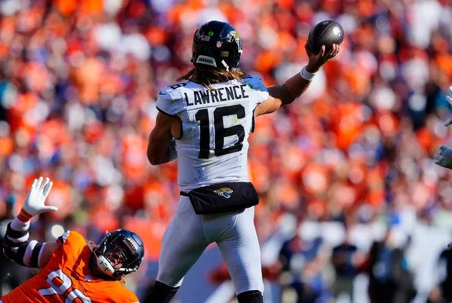 Sep 20, 2026; Denver, Colorado, USA;  Jacksonville Jaguars quarterback Trevor Lawrence (16) throws downfield against the Denver Broncos at Empower Field at Mile High.  Mandatory Credit: Ron Chenoy-Imagn Images