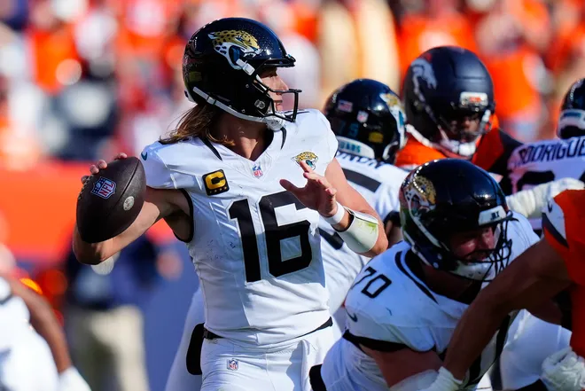 Sep 20, 2026; Denver, Colorado, USA;  Jacksonville Jaguars quarterback Trevor Lawrence (16) throws the ball against the Denver Broncos during the fourth quarter at Empower Field at Mile High.  Mandatory Credit: Ron Chenoy-Imagn Images