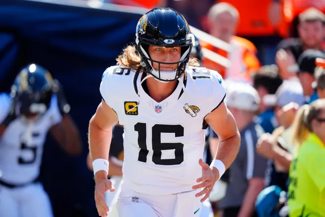 Sep 20, 2026; Denver, Colorado, USA;  Jacksonville Jaguars quarterback Trevor Lawrence (16) warms up prior to a game against the Denver Broncos at Empower Field at Mile High.  Mandatory Credit: Ron Chenoy-Imagn Images
