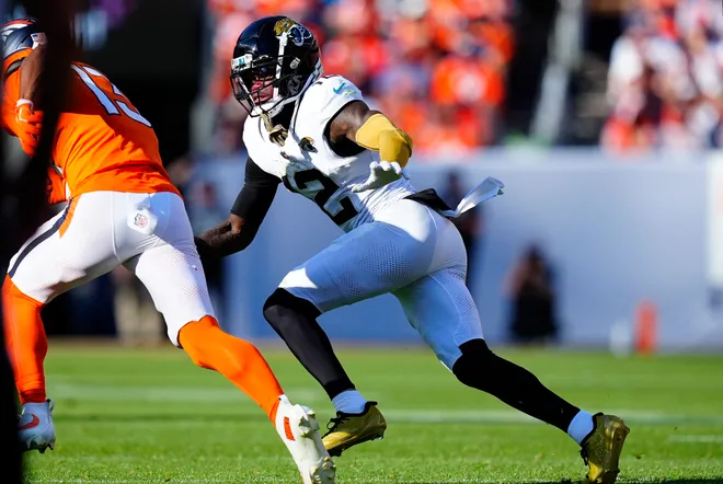 Sep 20, 2026; Denver, Colorado, USA;  Jacksonville Jaguars wide receiver Travis Hunter (12) playing on defense against the Denver Broncos during the fourth quarter at Empower Field at Mile High.  Mandatory Credit: Ron Chenoy-Imagn Images