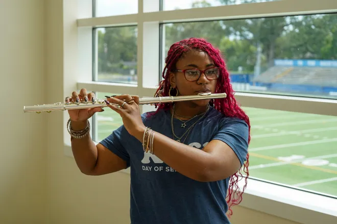A new flute donated to Riverside High is played by a music student at the school, which received about $38,500 worth of instruments from the Mr. Holland’s Opus Foundation,