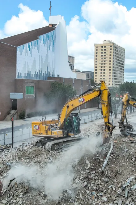 Excavator operators move debris from the teardown of the First Baptist Church of Jacksonville’s old sanctuary in downtown Jacksonville, Fla., on Wednesday, September 23, 2026.