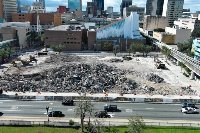 Traffic makes its way along West Union Street as construction workers use excavators to move debris from the teardown of the First Baptist Church of Jacksonville’s old sanctuary in downtown Jacksonville, Fla., on Wednesday, September 23, 2026.