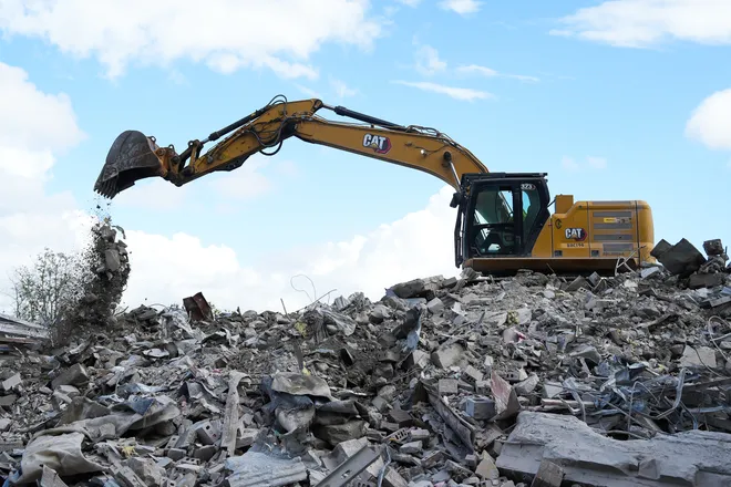 An excavator operator makes piles of debris from the teardown of the First Baptist Church of Jacksonville’s old sanctuary in downtown Jacksonville, Fla. Wednesday, September 23, 2026.